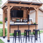 Backyard Discovery Cedar Springs Cedar Wood Outdoor Bar Set with Steel Countertops Shelving and TV Mount Privacy Wall